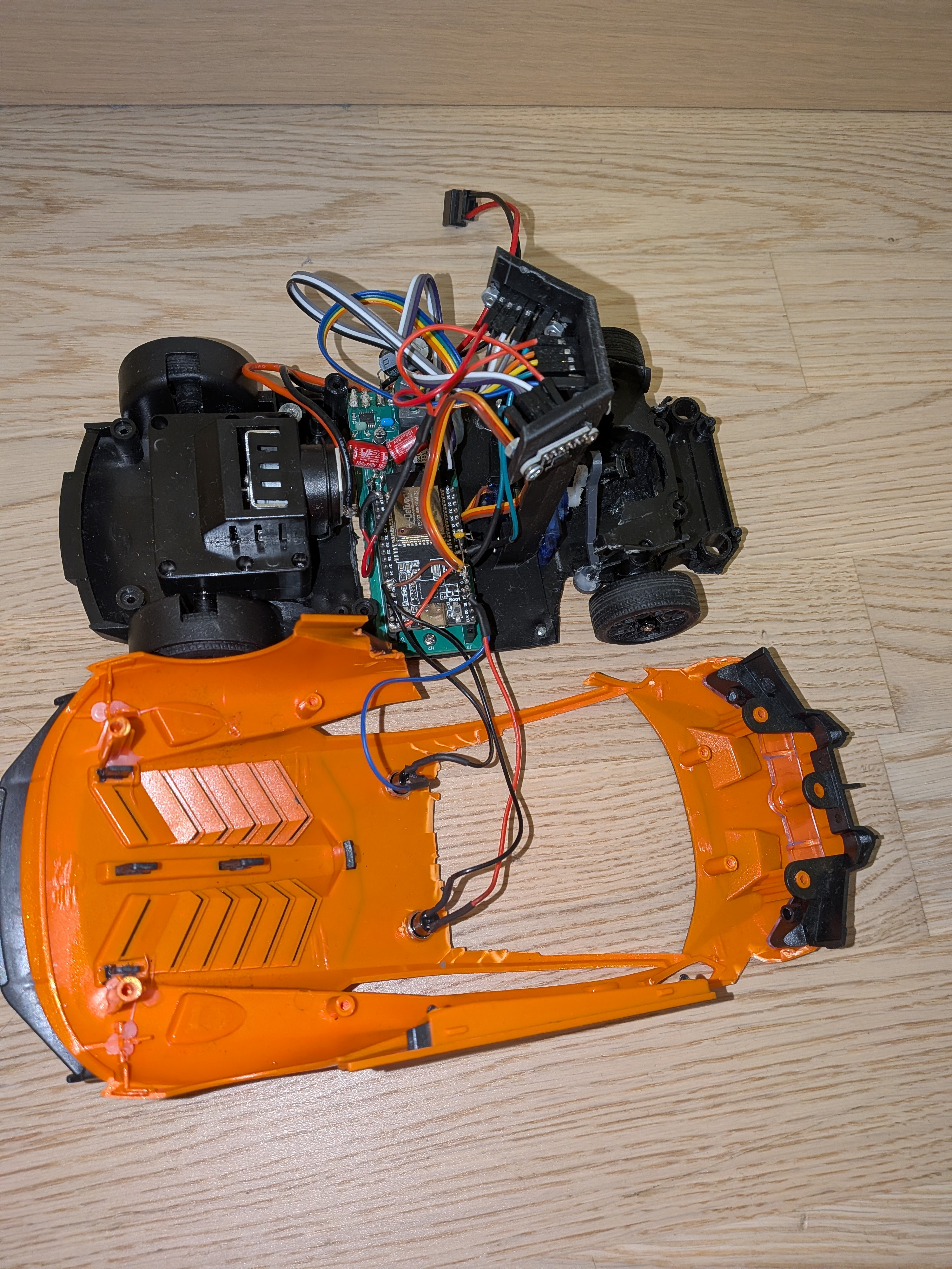 Figure 2: Interior electronics layout with ESP32, steering micro-servo, and custom PCB.