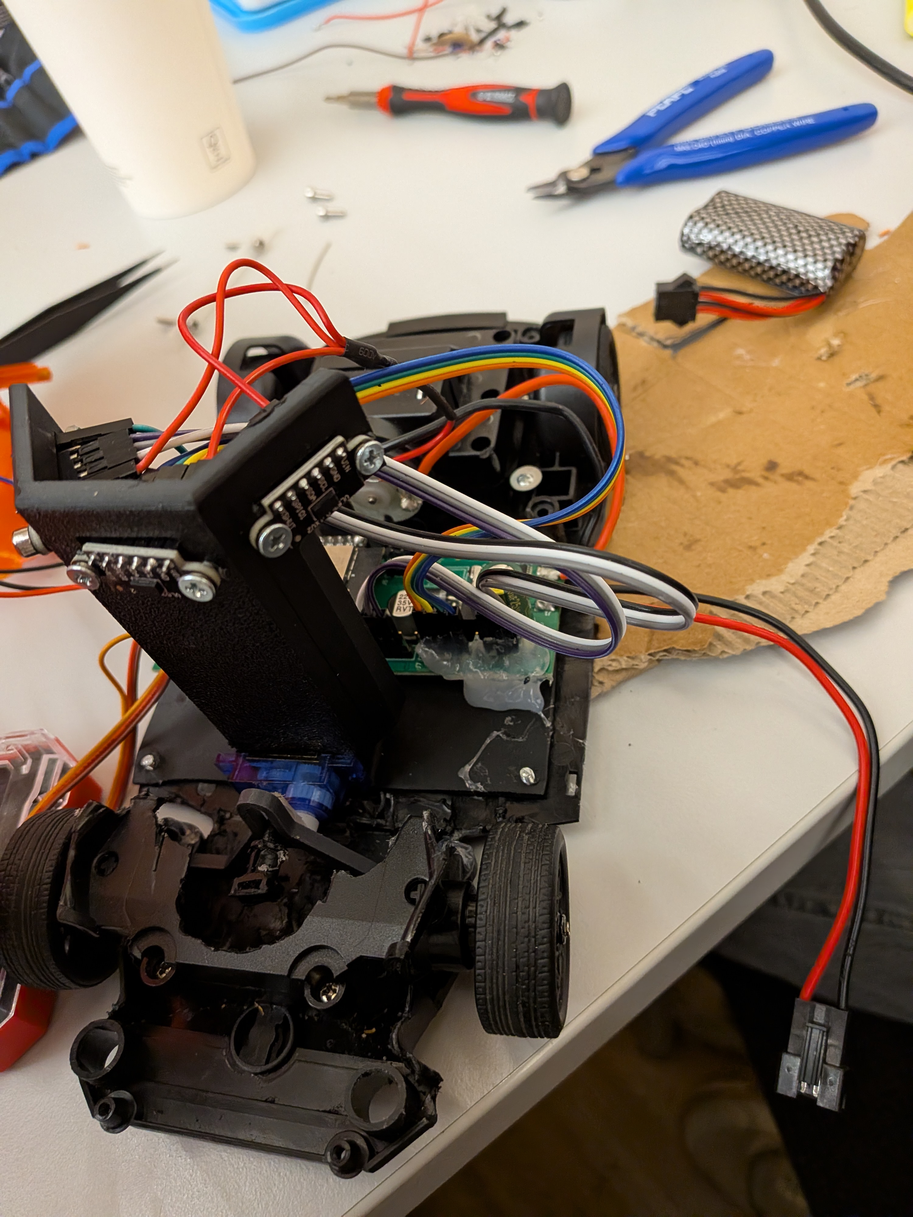 Figure 3: On-site hardware assembly and diagnostic session at the Graz competition venue.